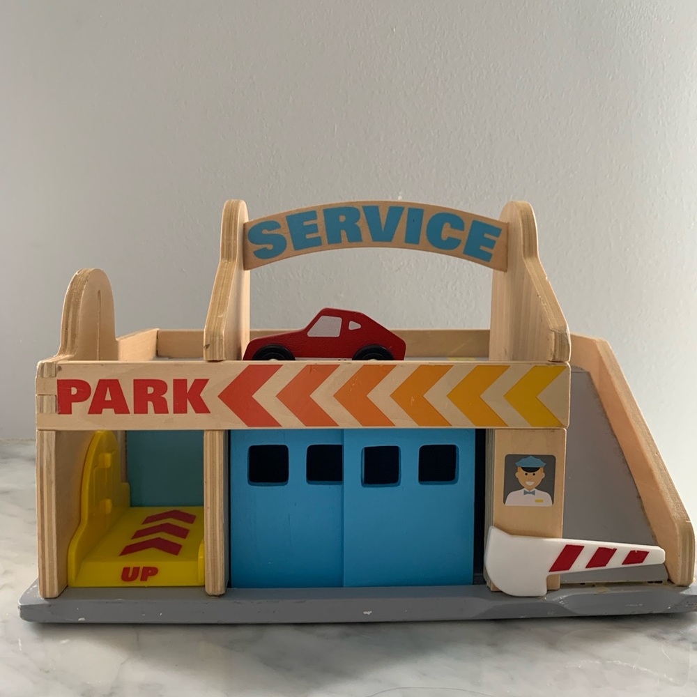 **SOLD-** Melissa & Doug Wooden Service Station with Red Car